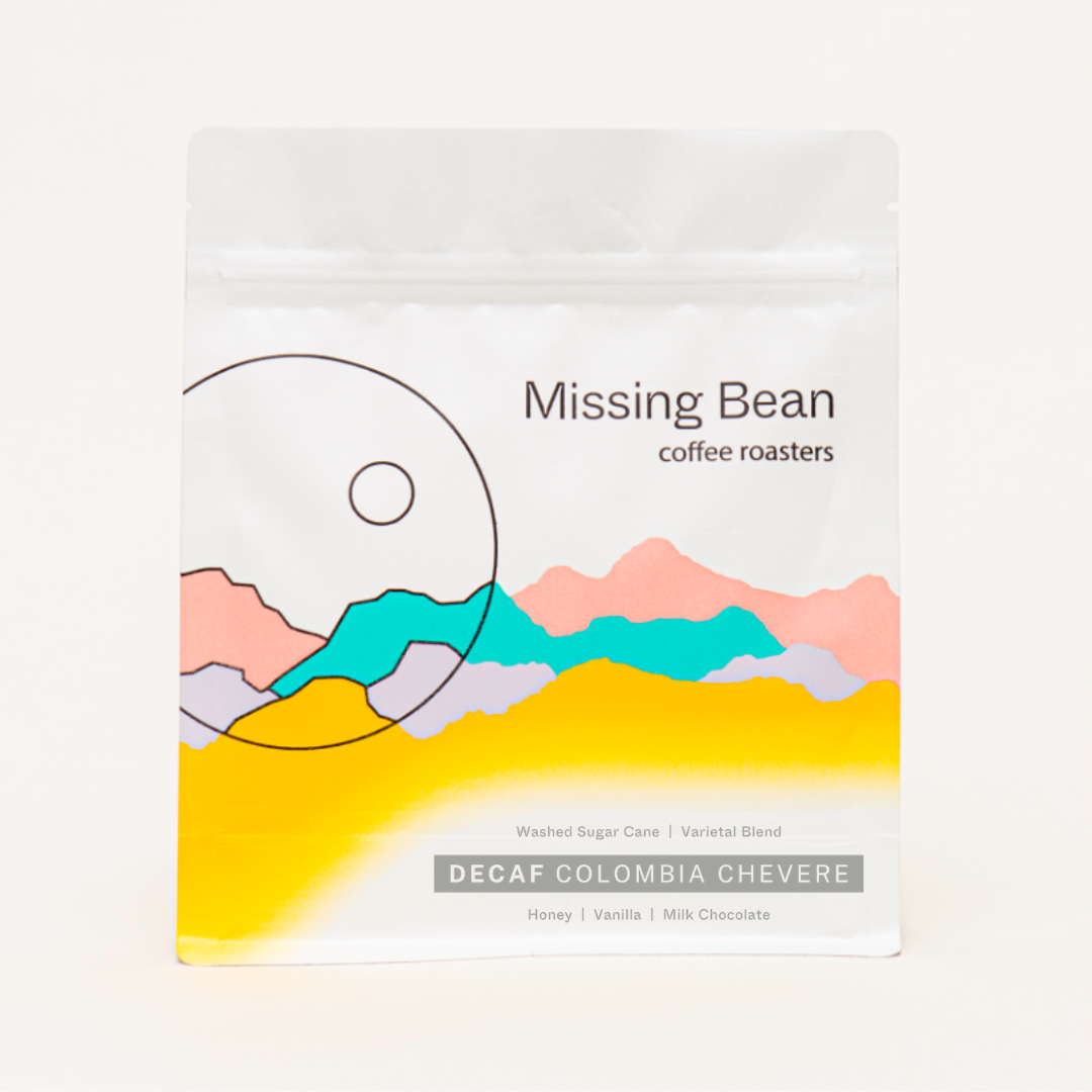 250g bag of Missing Bean's decaf Colombia Chevere coffee beans, with tasting notes of honey, vanilla and milk chocolate.