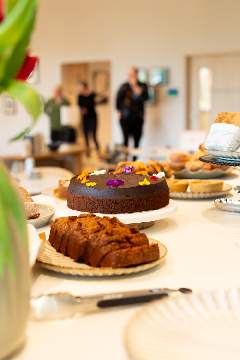A picture of a chocolate cake on the counter of Missing Bean's Cowley cafe.