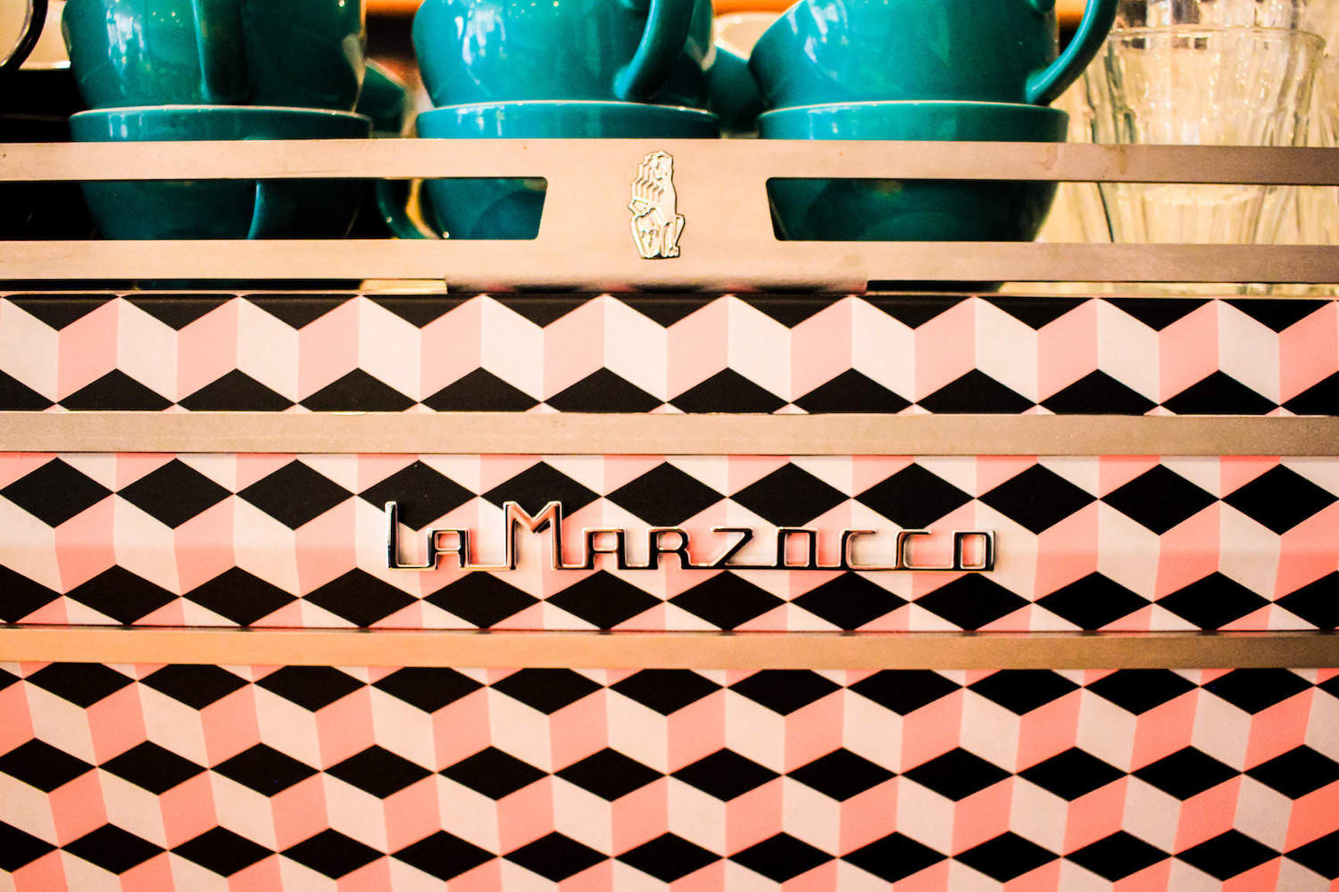 A customised pink and black cubes La Marzocco coffee machine, serving Missing Bean wholesale coffee