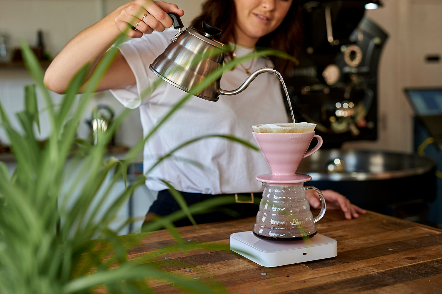 Barista using a V60 to pour Missing Bean coffee at East Oxford Roastery and cafe