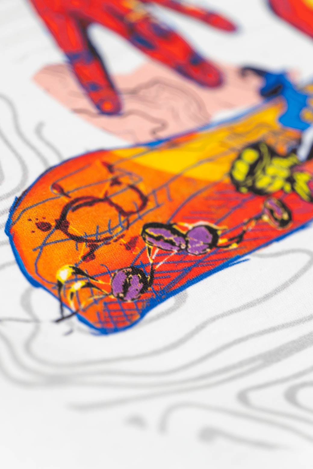 Close up of the back print of the white Missing bean X Brian Gray T-Shirt, the back print depicts two hands spelling out MB which are detailed with a range of clever, original, sketches to signify the journey of a coffee bean.