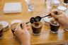Coffee cupping using Missing Bean branded cupping spoons. 